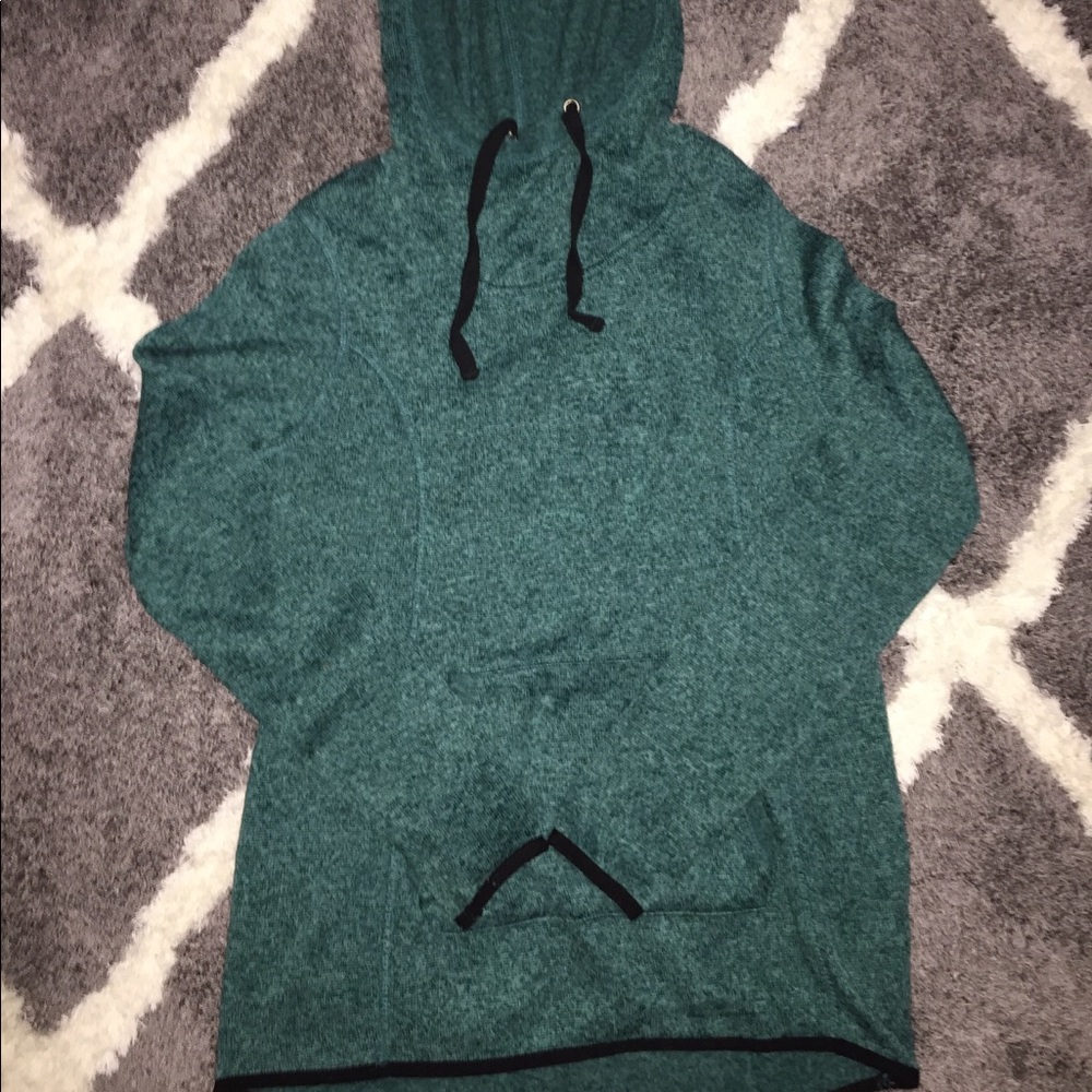 a greenish bluish sweatshirt